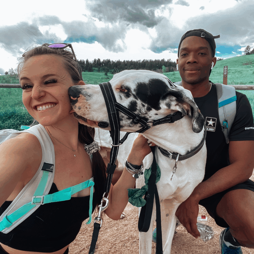 Haley, Dymond, and Brandon smiling on a hiking trail